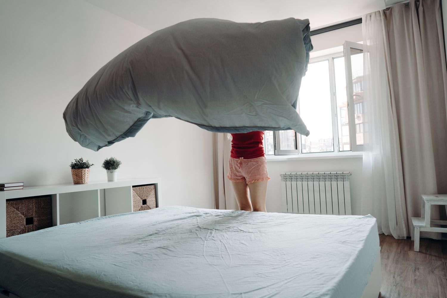 woman making bed