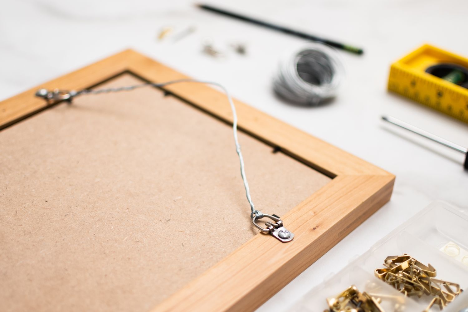 Back of picture frame with wire attached for hanging