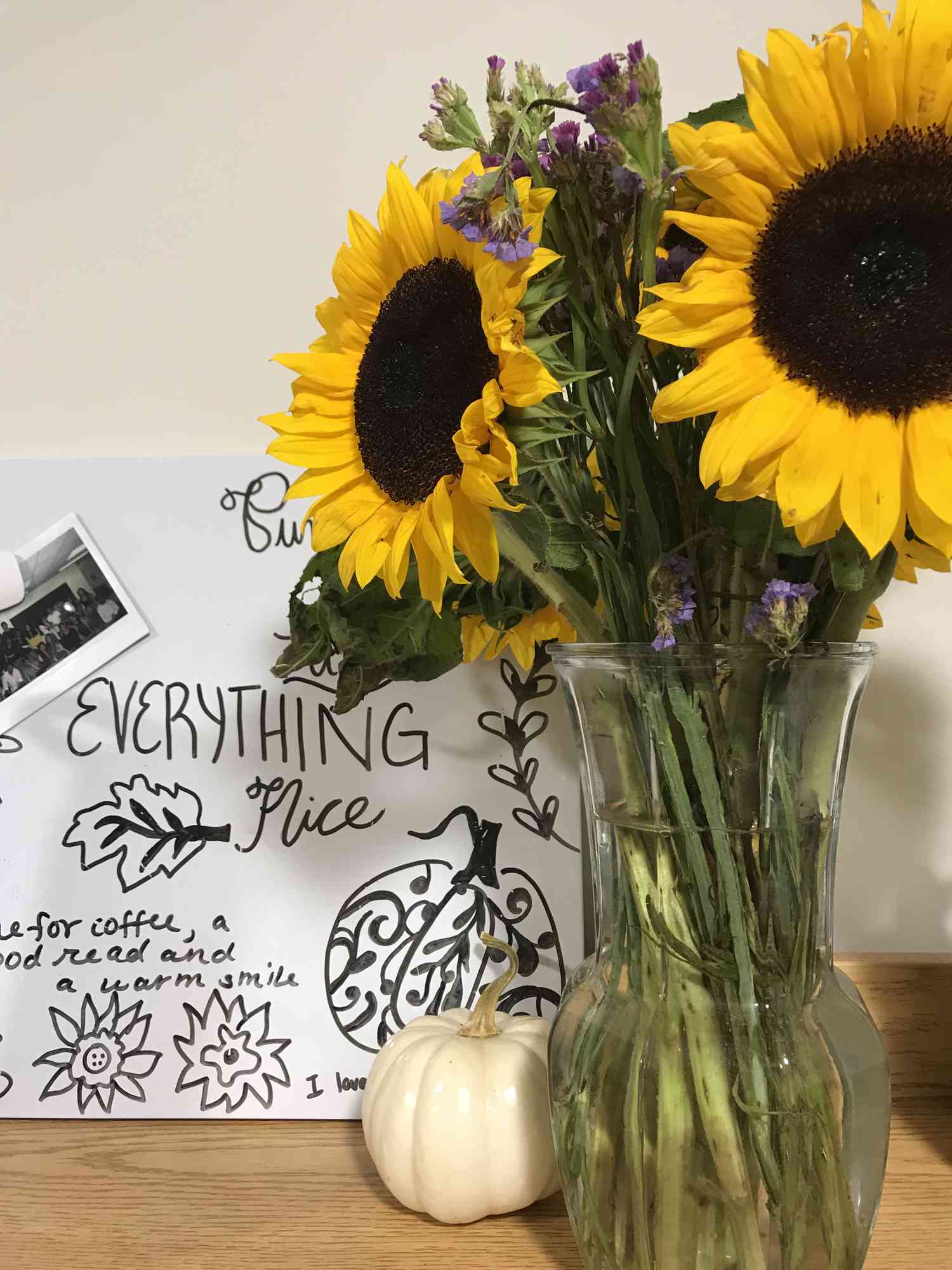 sunflowers in a vase and pumpkin