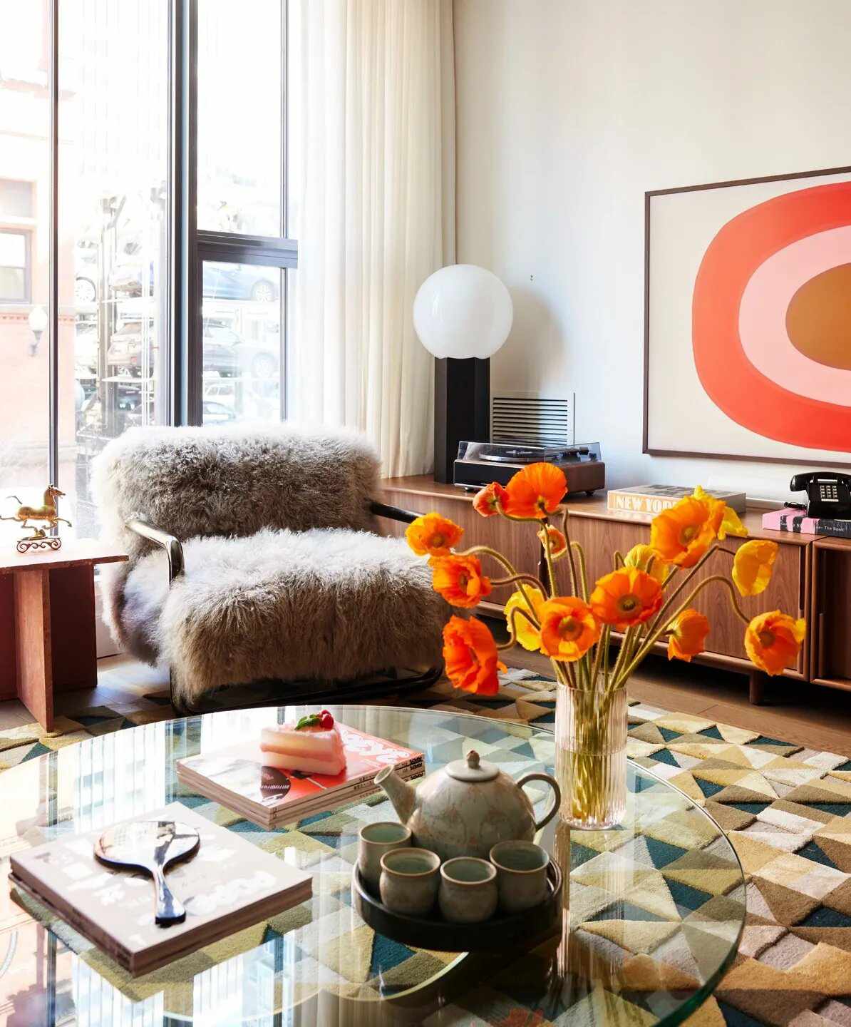 Living room with bright art and poppy flowers