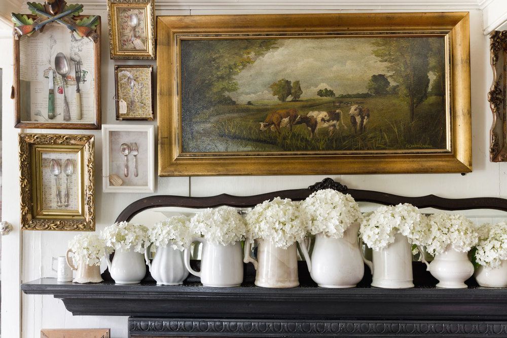 A wall decorated with antique spoons, which have been framed