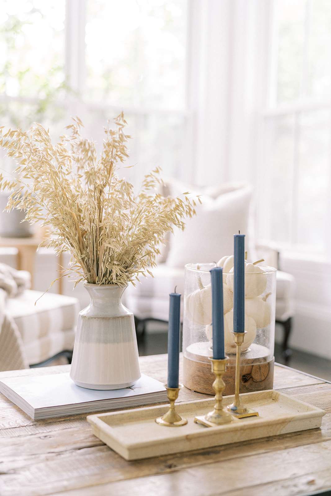 Coffee table with candle sticks and fall decor