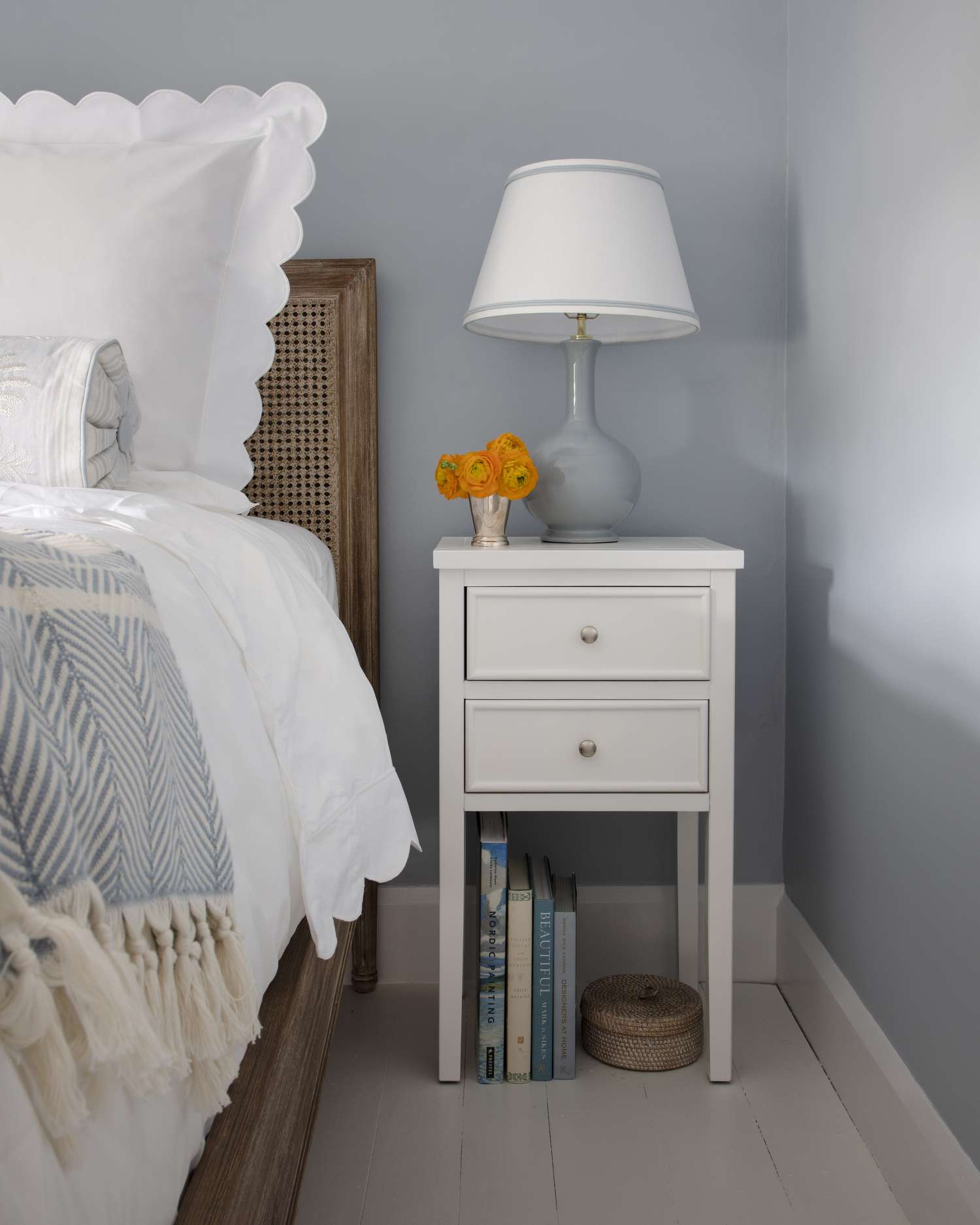 nightstand with fresh flowers in vase