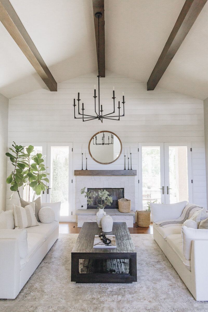 white shiplap farmhouse decorated living room
