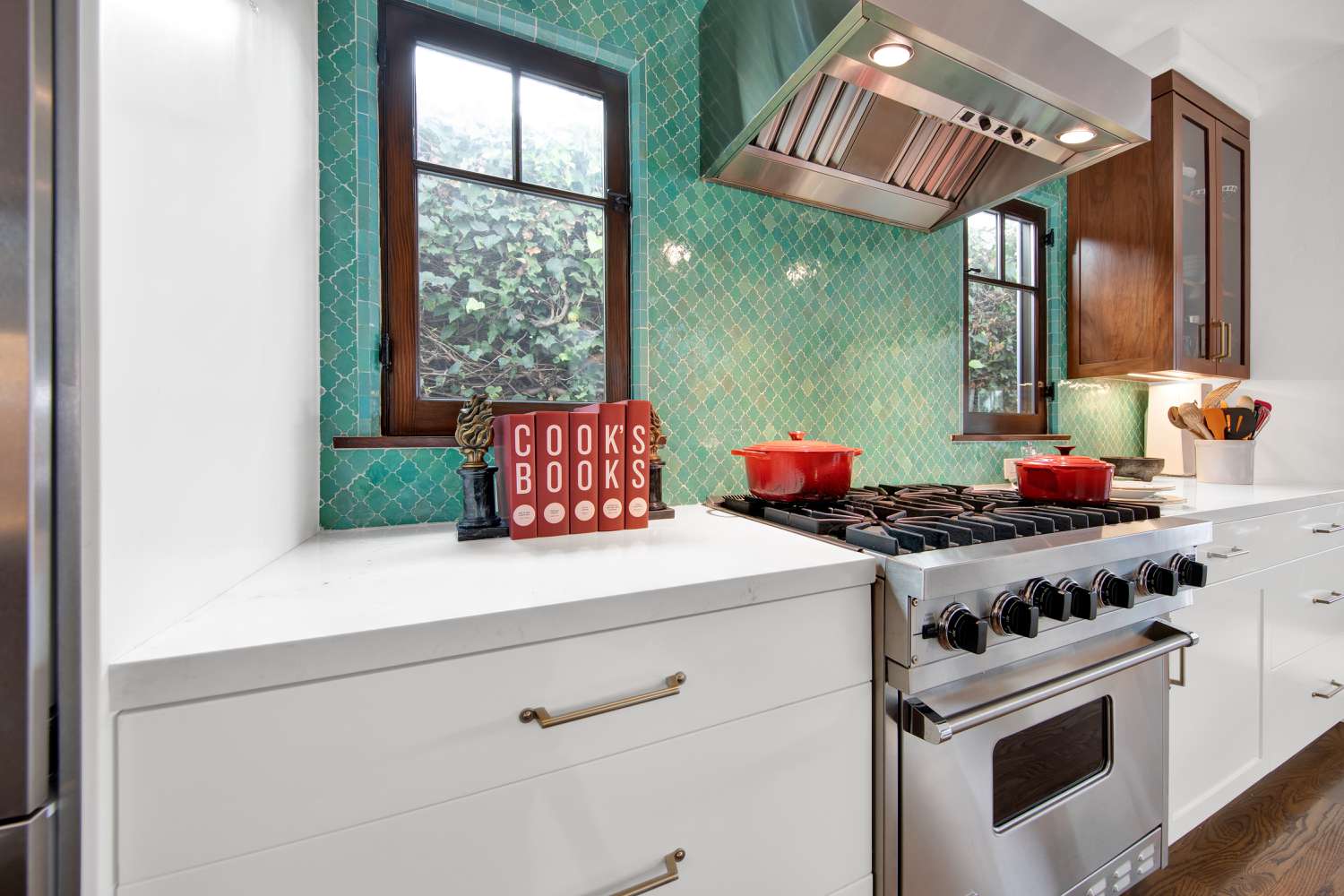 Using trim tile to surround windows in a kitchen backsplash. Zellige color tiles.