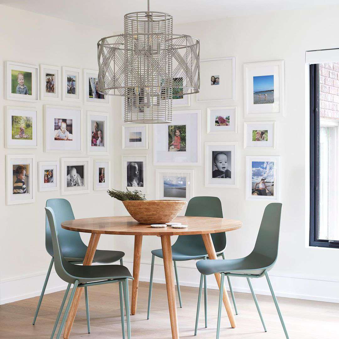 Small modern dining room with gallery wall