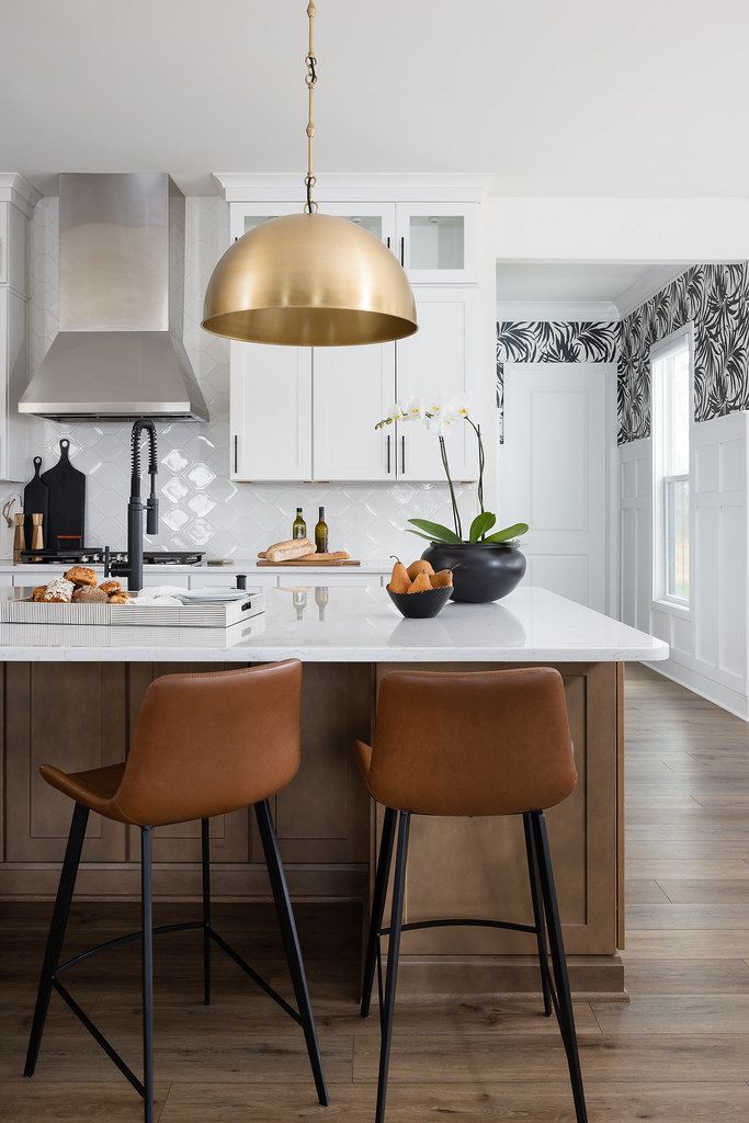 Bright and modern kitchen with white shaker cabinets.