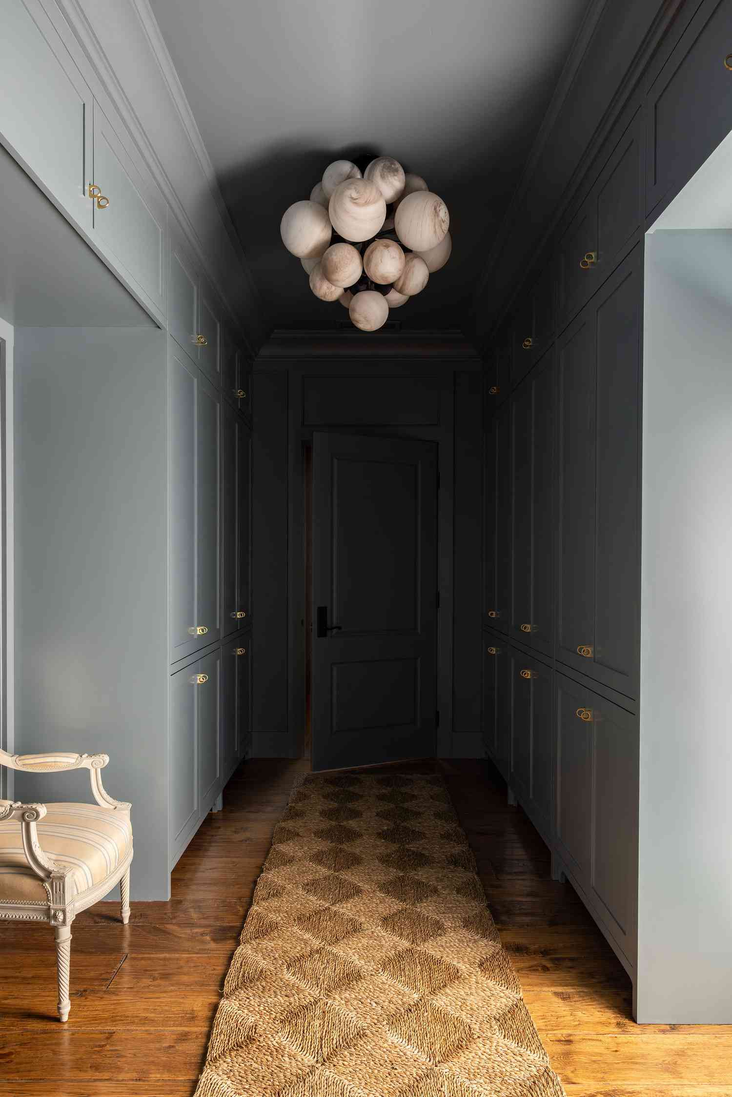 Slate blue color-drenched hallway.