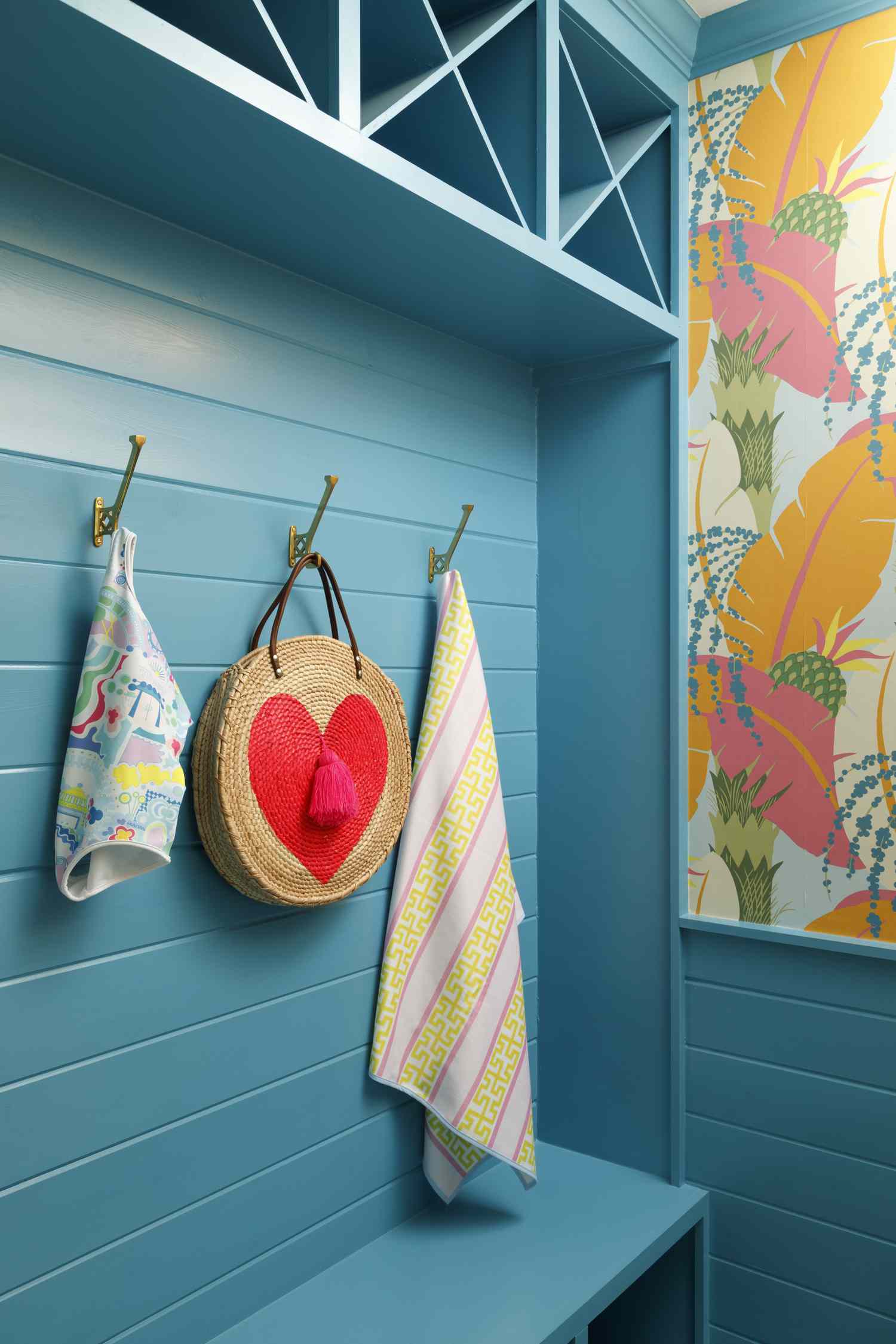 Bright blue hallway with bright wallpaper.