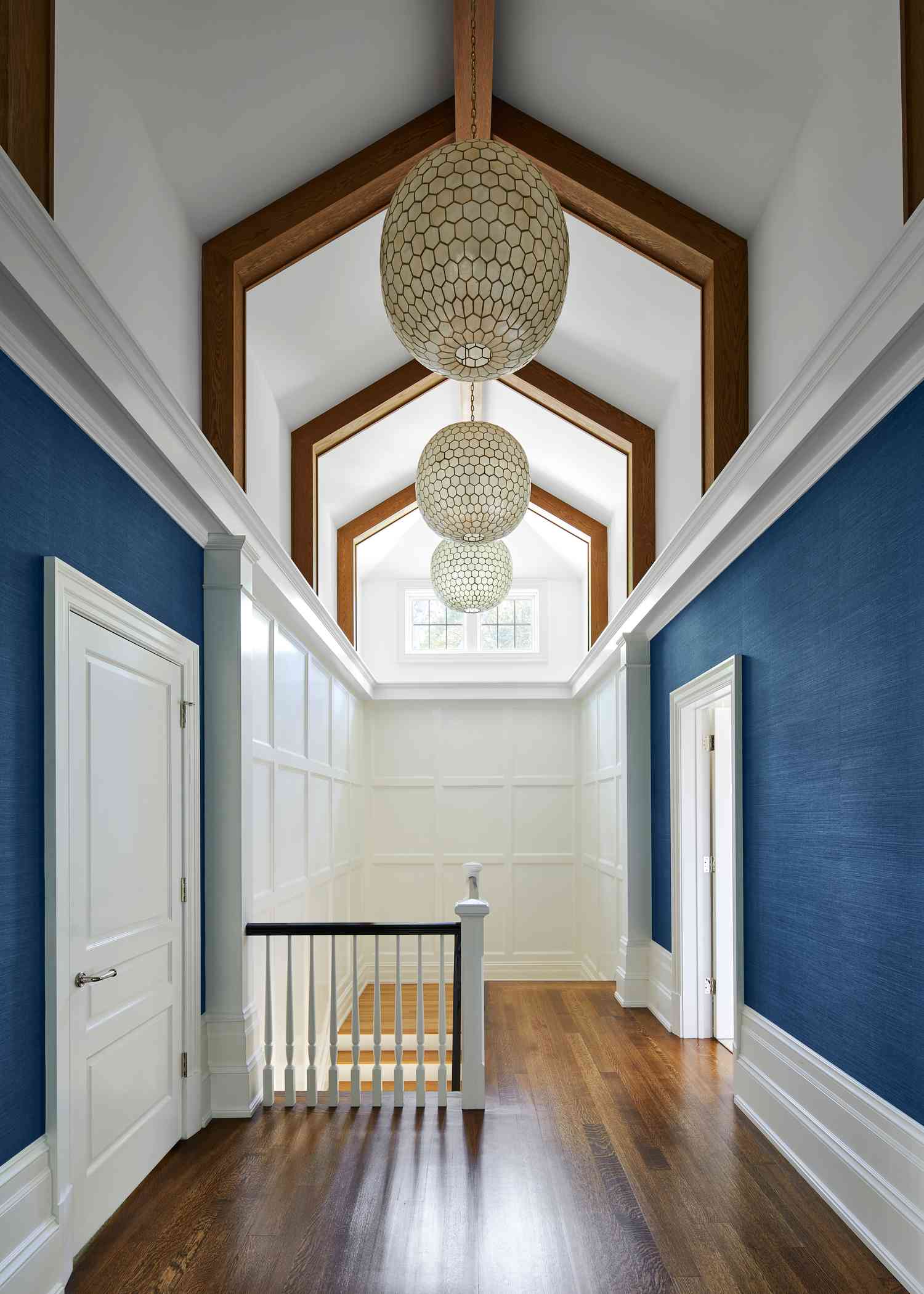 Hallway with blue wallpaper.