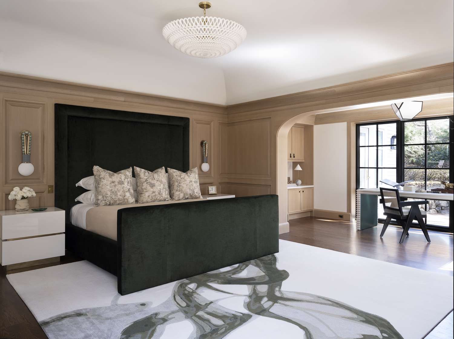 chandelier hanging above bed