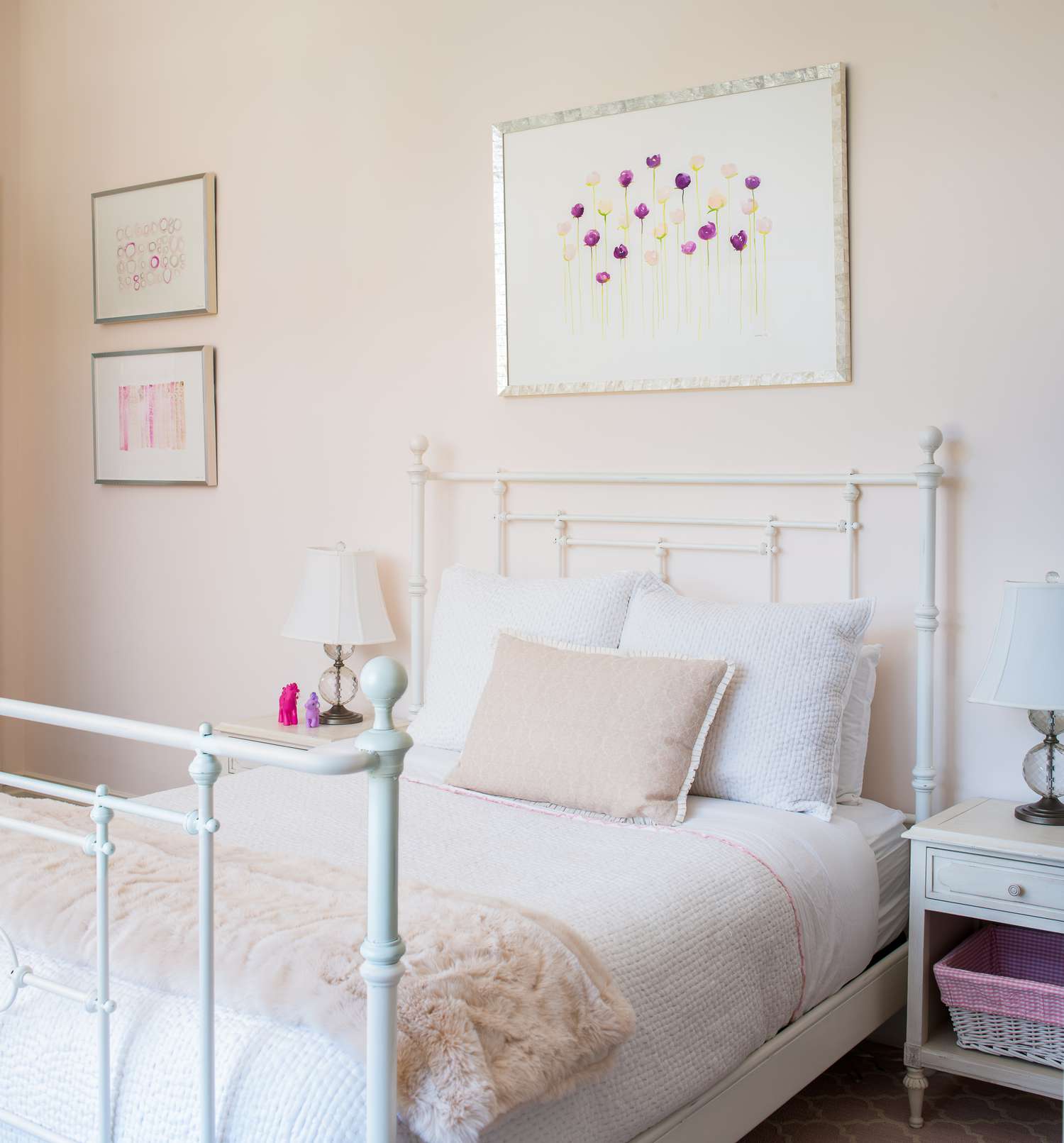 framed botanical art above girl's bed