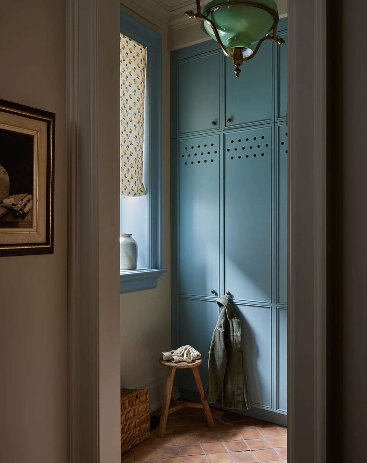 Ashley Montgomery Design teal blue mudroom