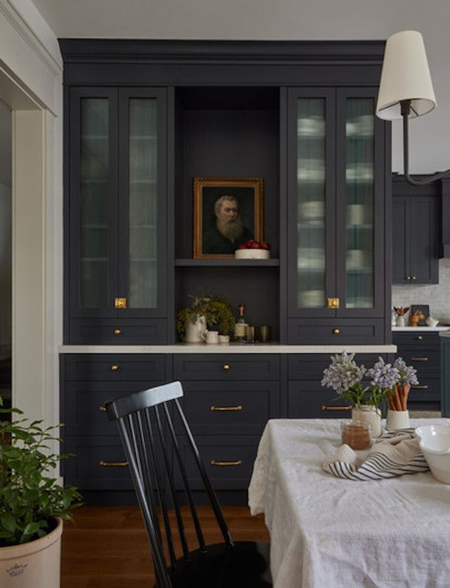 dark cabinets with bronze hardware