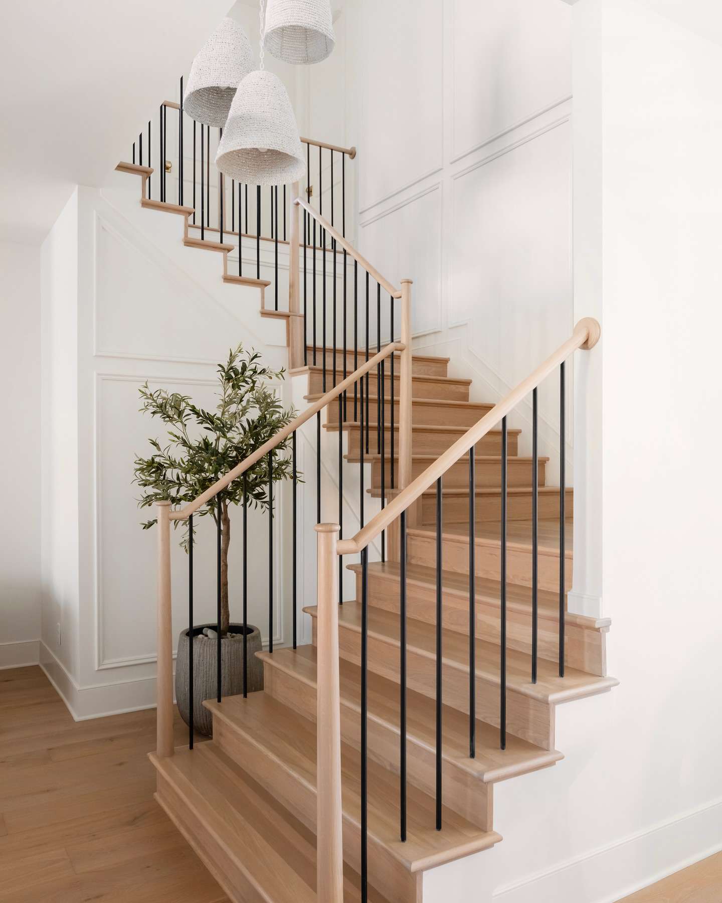 modern staircase with black railing