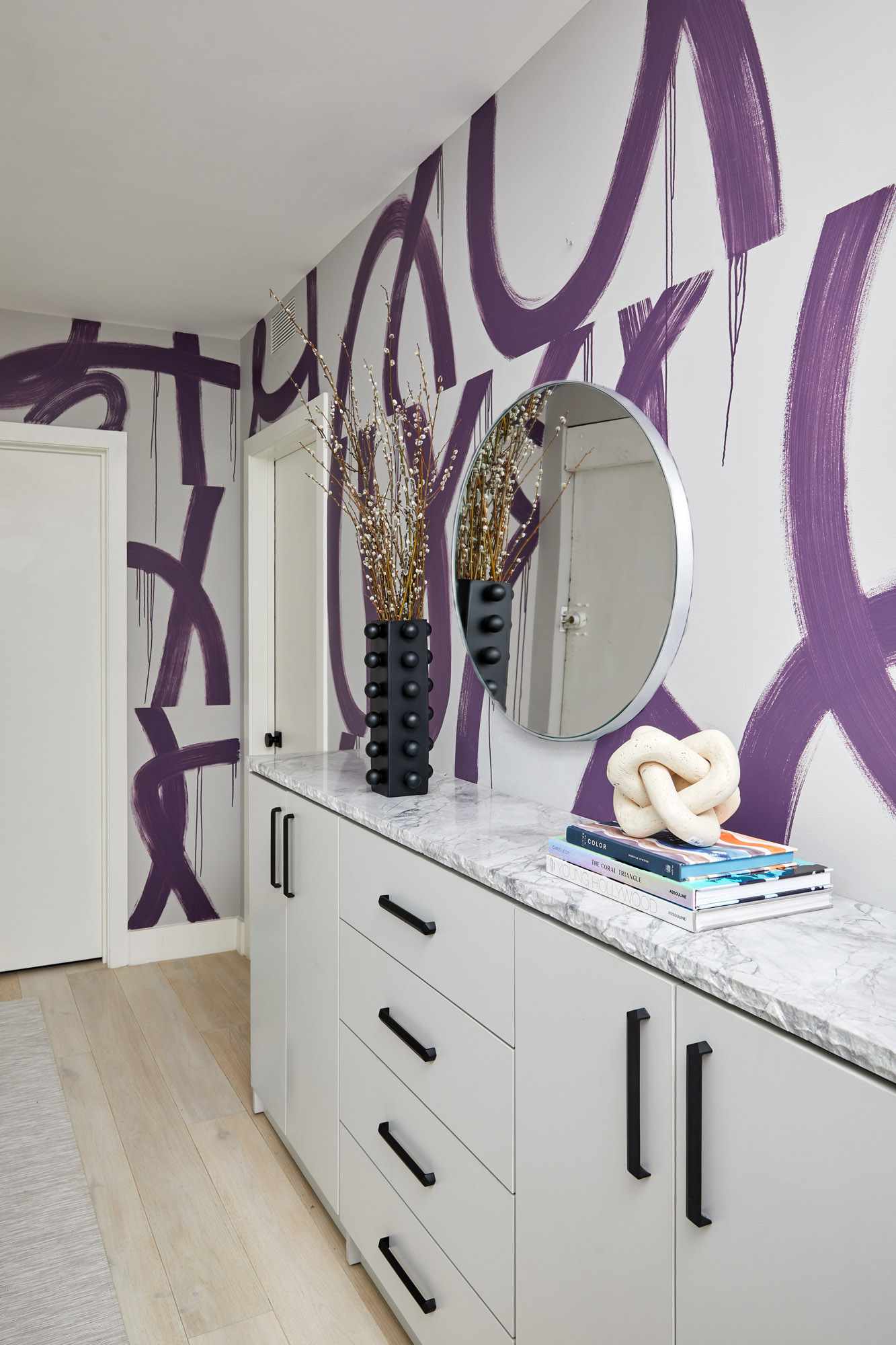Entryway with purple patterned walls