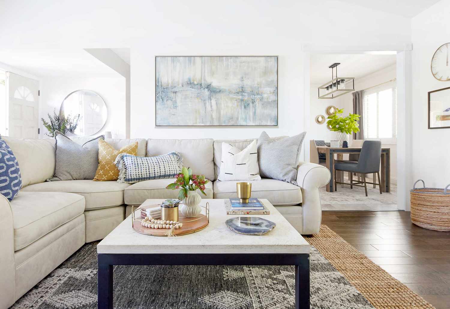 Living room with soft blue art piece.