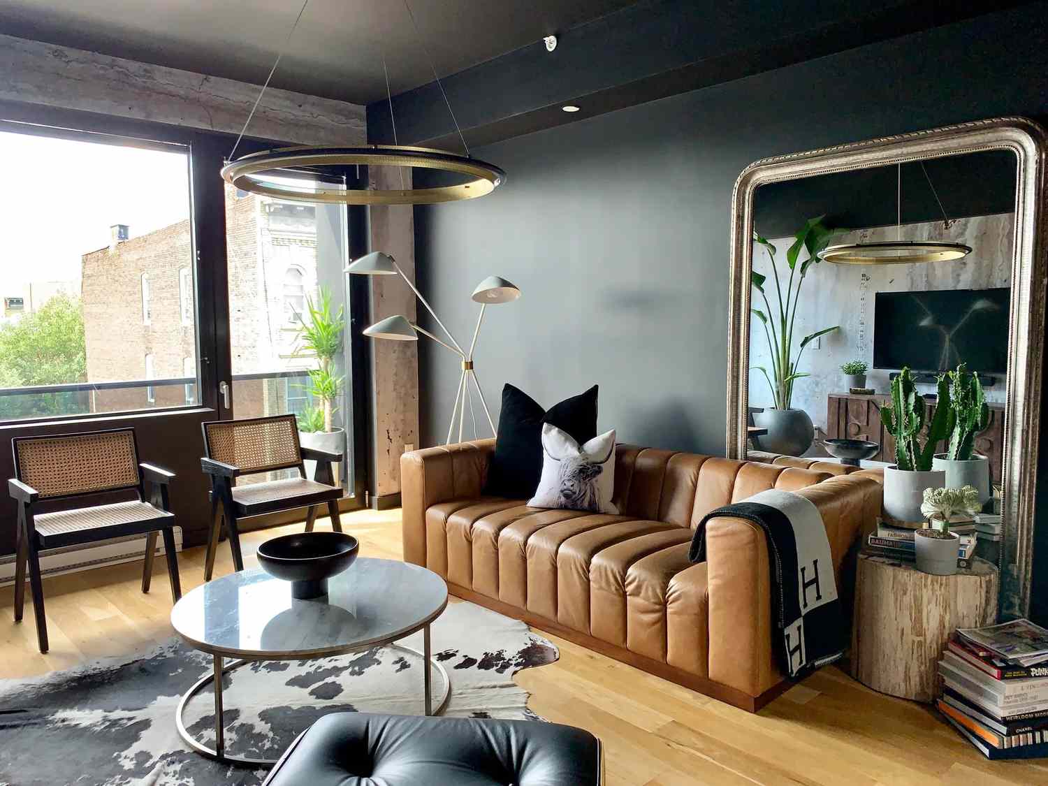 Living room with large oversized mirror.