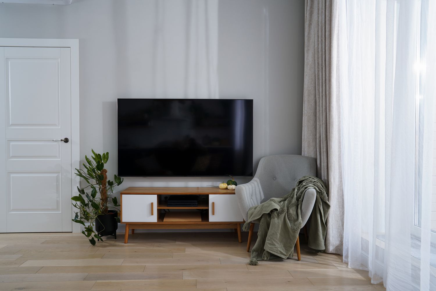 living room with small console below tv 
