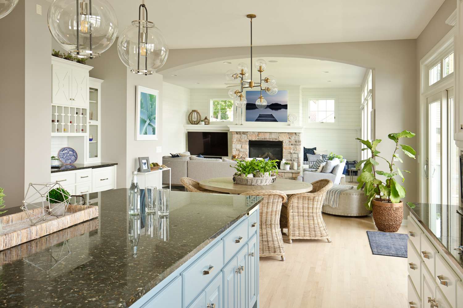 open concept kitchen and living room with green countertop